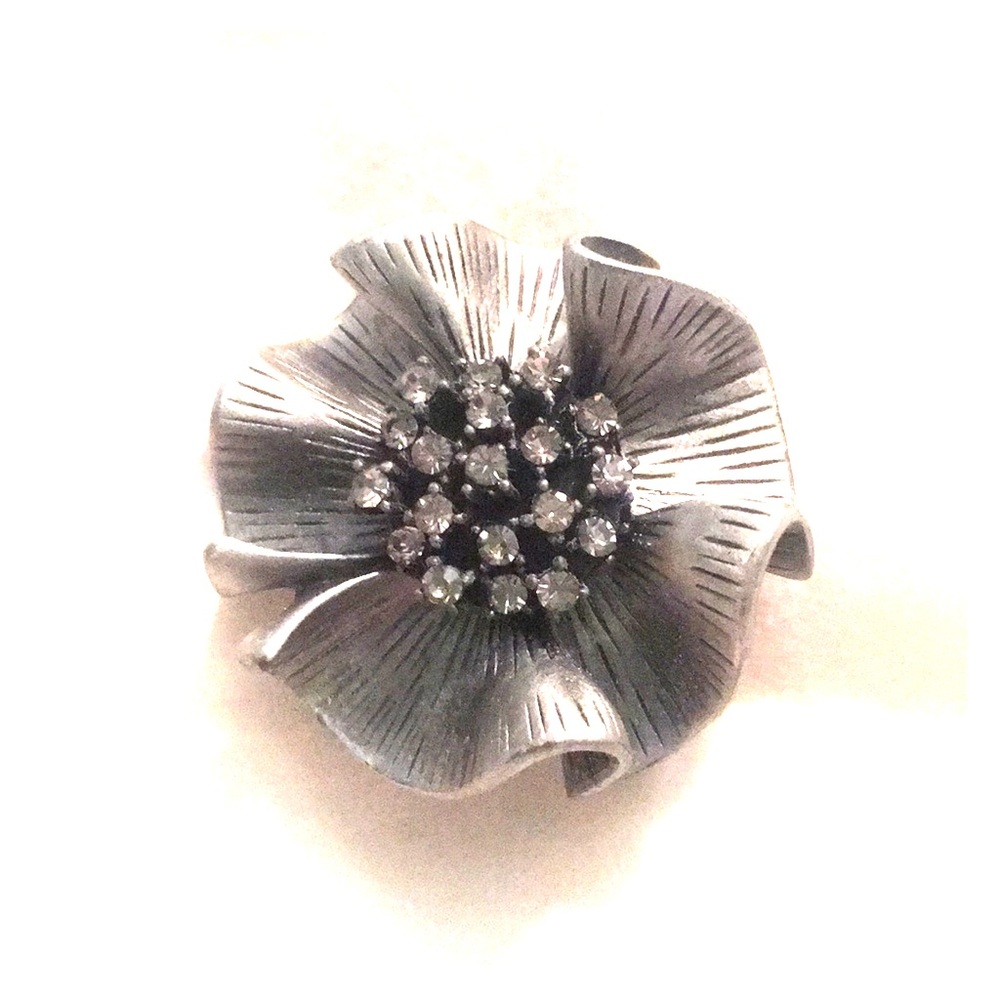 Silver and black brooche